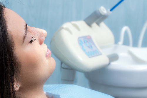 closeup of a relaxed young woman in dental chair, sedation dentistry