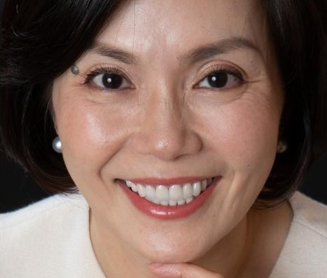 Newport Beach patient after undergoing a full cosmetic smile makeover