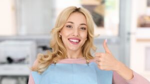 happy woman in a dental chair. sedation dentistry